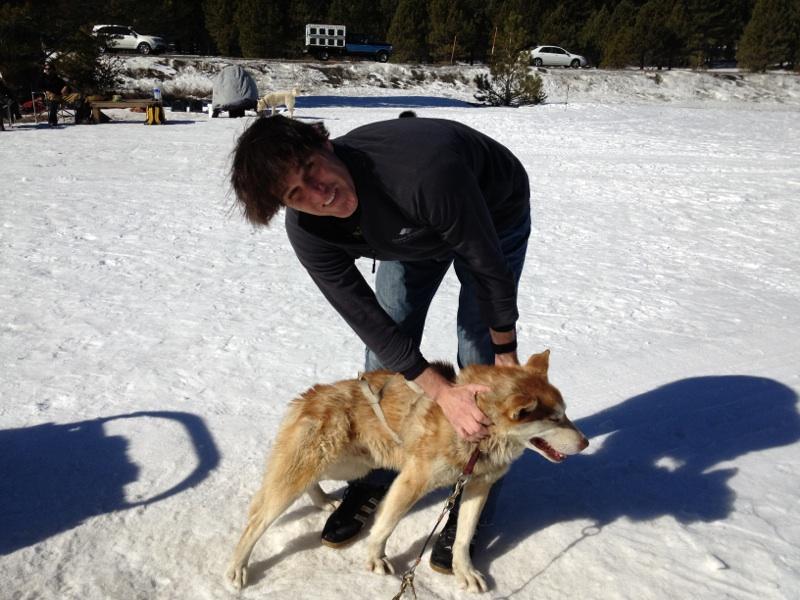 Author in snow with Mammoth Mountain Husky Dog